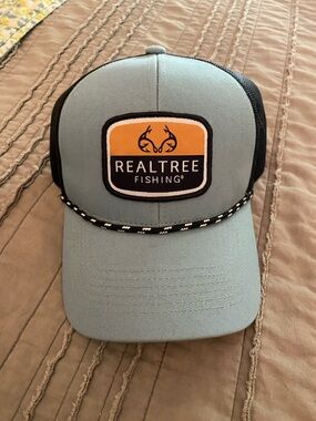 Realtree - Fishing Trucker Hat in Light Blue and Black with Orange Patch